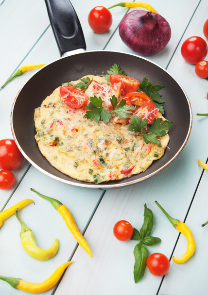 Omelet with cheese and cherry tomato - Фото, изображение