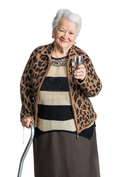 Old woman with glass of water - Photo, Image