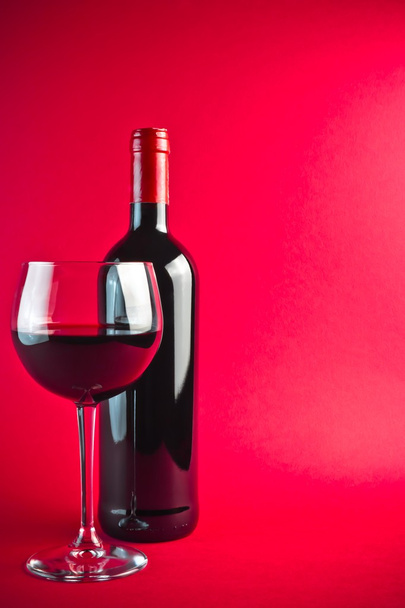 Bottle with red wine and glass - Valokuva, kuva
