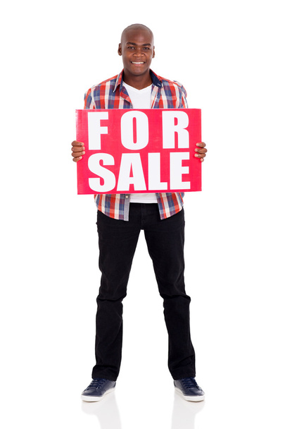 man holding for sale sign - 写真・画像