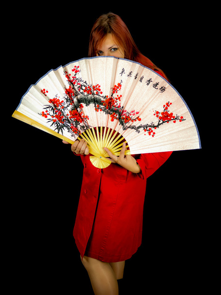 Girl hiding behind japaneese fan. - Φωτογραφία, εικόνα