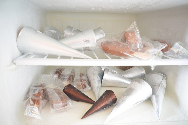 a lot of ice cream in the refrigerator - Photo, Image