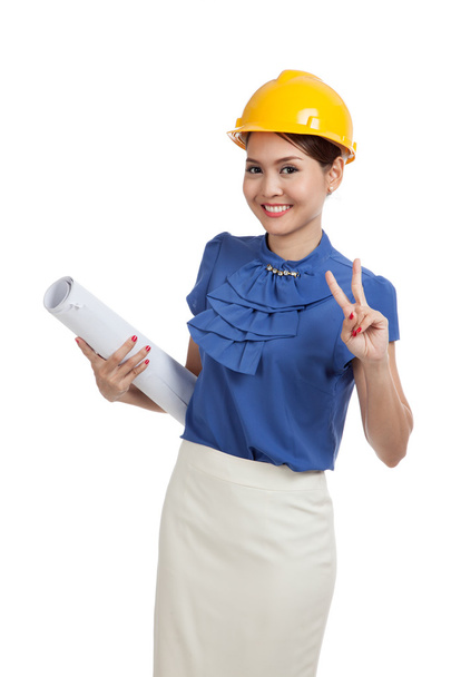 Asian engineer woman with blueprints show victory sign - Foto, afbeelding