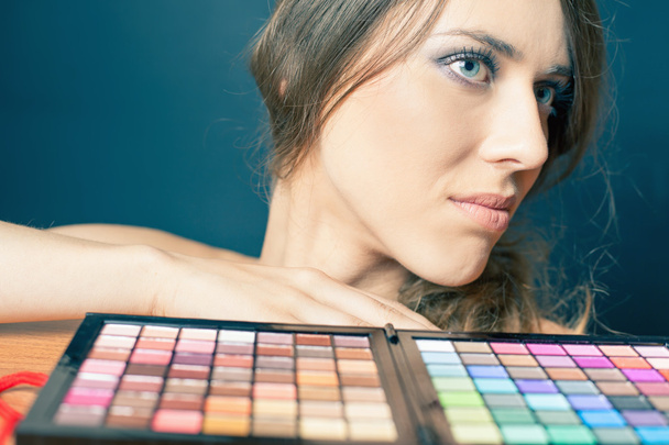 Glamor woman with colorful palette for fashion makeup - Fotó, kép