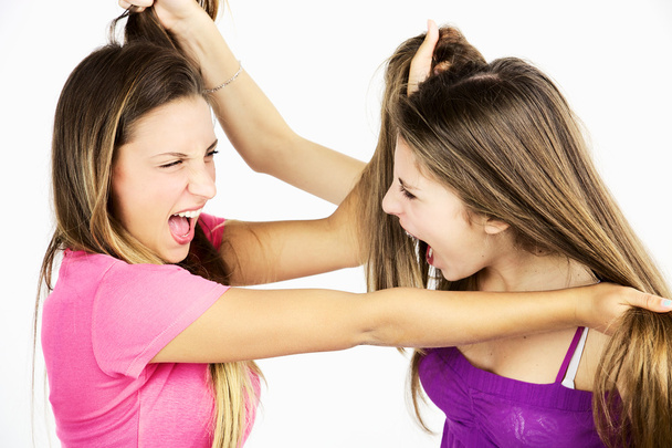 Two teenager friends fighting pulling long hair isolated - Foto, Imagen