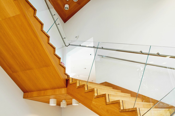 Modern interior with wooden stairs - Fotoğraf, Görsel