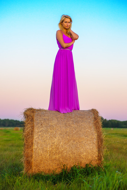 happy woman with hay in meadow field - Photo, image