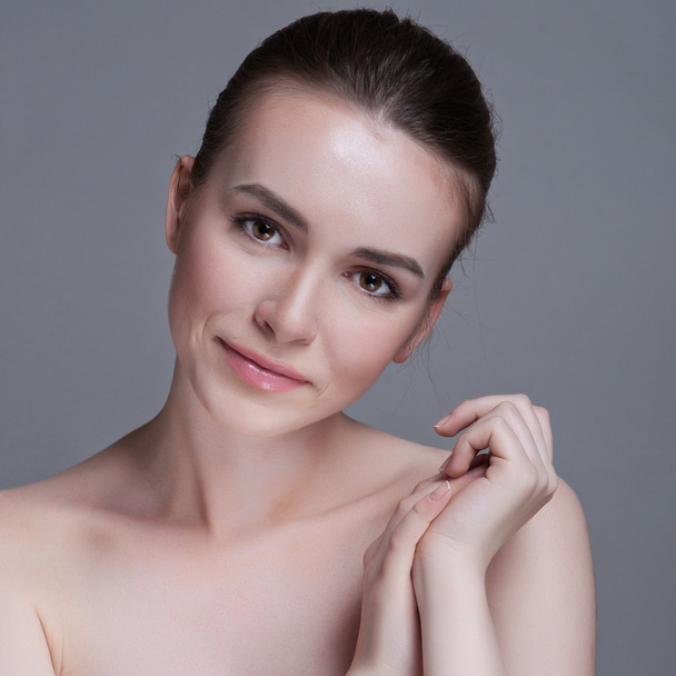 Beautiful face of young adult woman with clean fresh skin - Fotografie, Obrázek