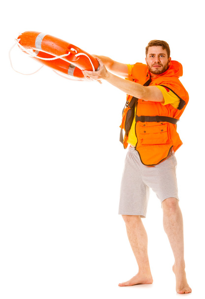 Lifeguard in life vest with ring buoy lifebuoy. - Fotoğraf, Görsel