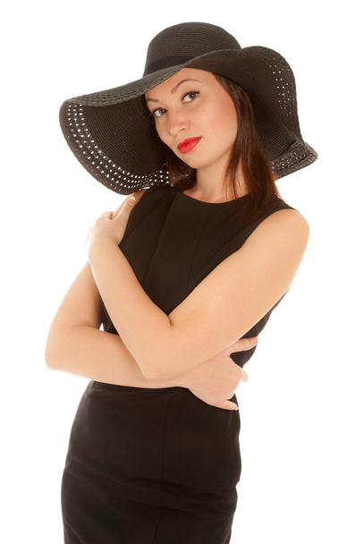 Beautiful woman with red lips in little black dress and hat iso - Foto, afbeelding