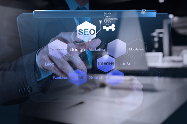businessman hand showing search engine optimization SEO - Foto, Bild