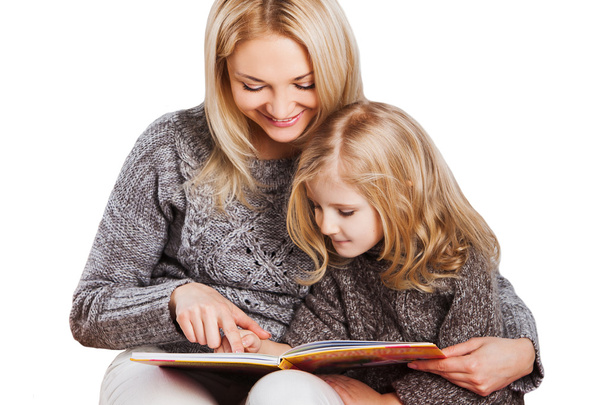 Mother reading with little daughter - 写真・画像