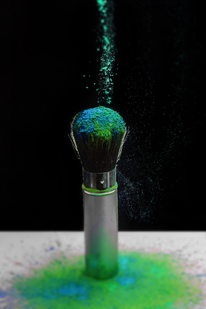 Makeup brush with holi paint - Фото, зображення