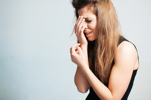 The upset woman loudly cries - Фото, изображение