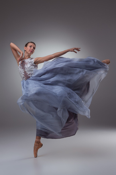 The beautiful ballerina dancing in blue long dress - Foto, Bild