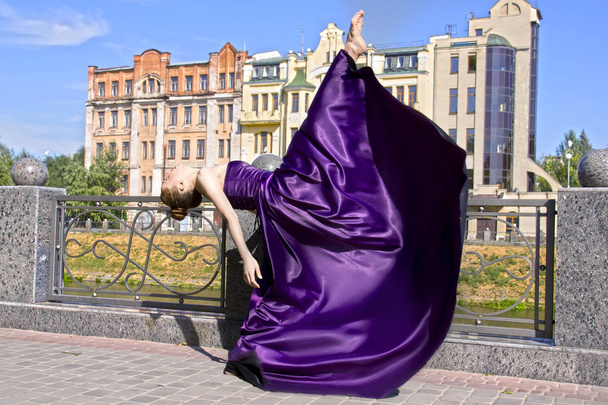 ballerina flats on the street in a long purple dress - Photo, Image