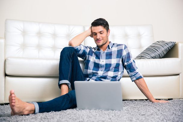 Man sitting on the floor with laptop - Photo, Image