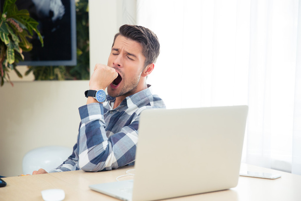 Portrait of a bored man yawning - Фото, изображение