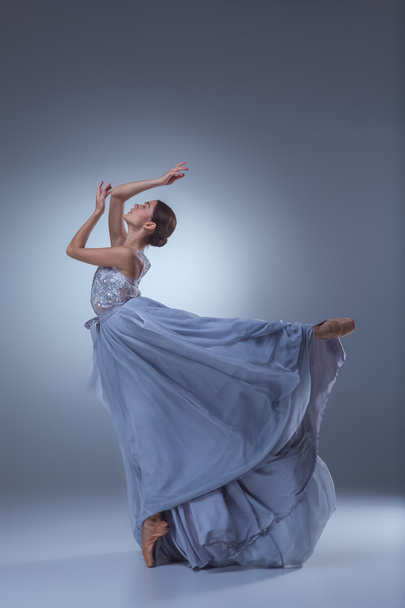The beautiful ballerina dancing in blue long dress - Foto, Bild