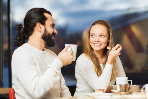 happy couple meeting and drinking tea or coffee - Φωτογραφία, εικόνα