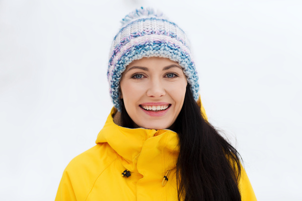 happy young woman in winter clothes outdoors - Valokuva, kuva