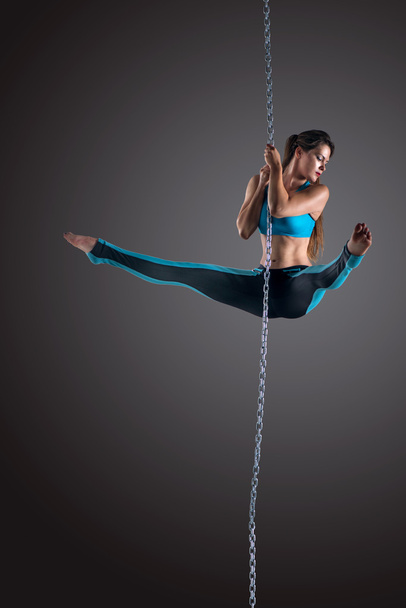 Girl performing aerial dance with chain - Fotoğraf, Görsel