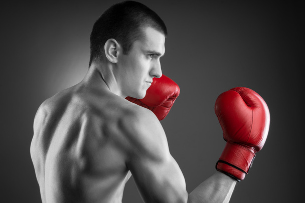 Blach and white fighter with red gloves. - Photo, Image