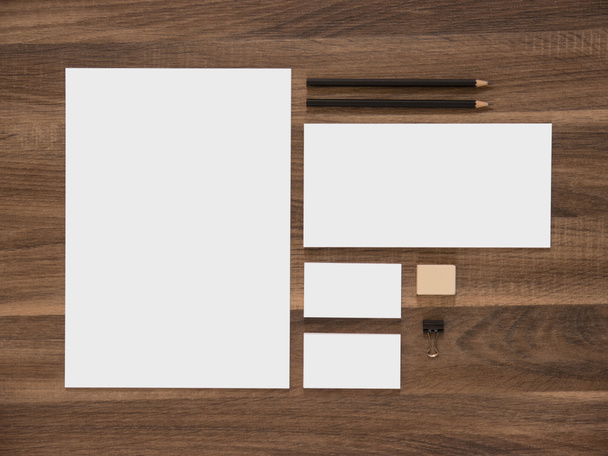 Letterhead, envelope and blank business cards on wooden desk. - Photo, Image