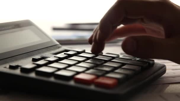 Business man working with calculator in the office - Filmagem, Vídeo