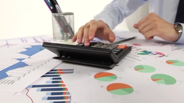 Business man working with calculator in the office - Filmagem, Vídeo