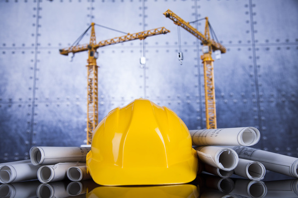 Crane, Safety helmet, Blueprints and construction site - Photo, Image