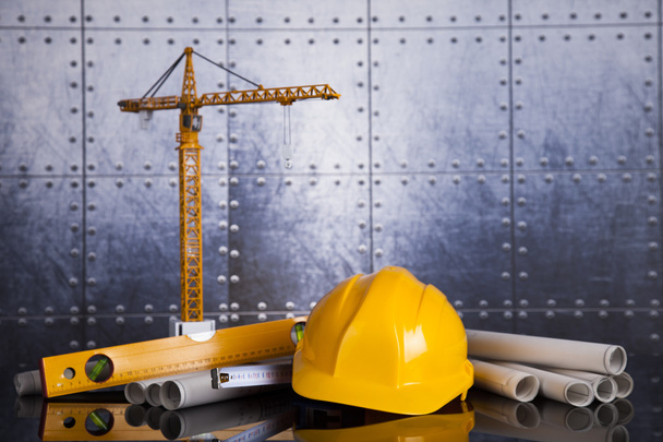 Crane, Safety helmet, Blueprints and construction site - Photo, Image