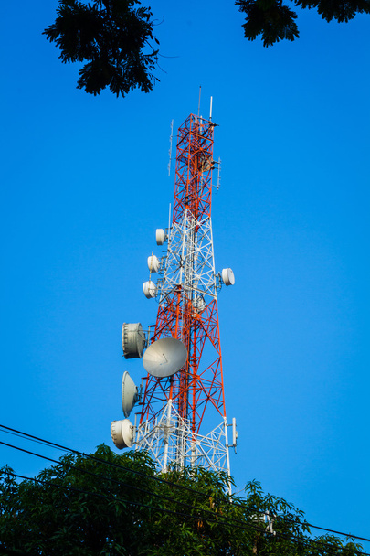 telecommunication tower and cloudy blue sky with foreground of p - Photo, Image