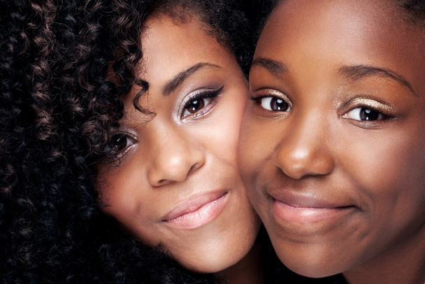 Closeup portrait of two young sisters. - Fotó, kép