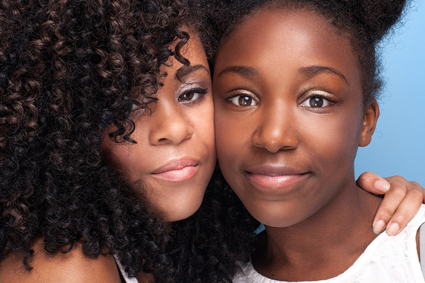Closeup portrait of two young sisters. - Photo, Image