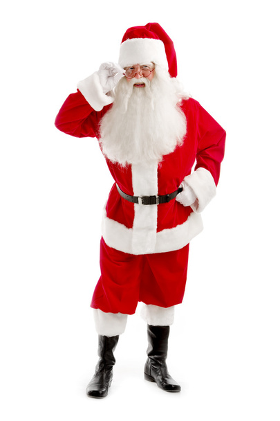 Santa - Claus looks Intently Through his Glasses Directly at the - Photo, image