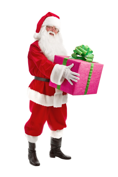 Santa Holding Christmas Present in his Hands on a White Backgrou - Foto, Imagen