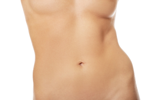 Slim naked woman's belly - 写真・画像