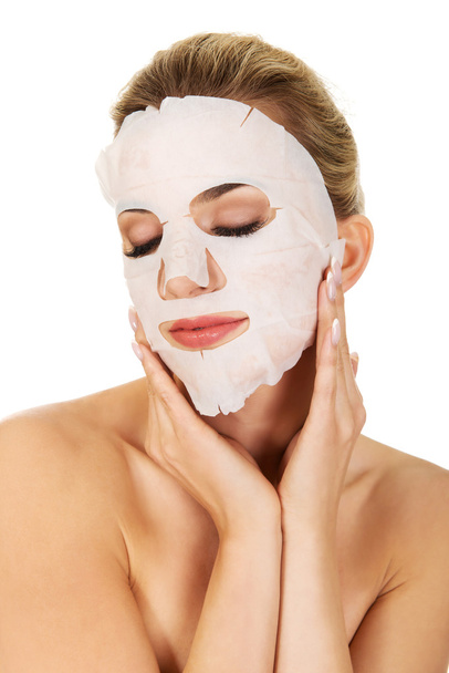 Young woman with facial mask - Photo, Image