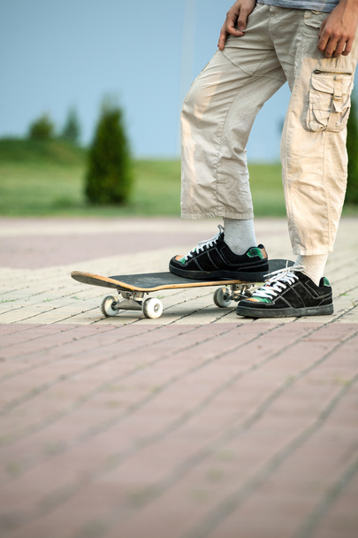 Young boy with skateboard - Fotografie, Obrázek