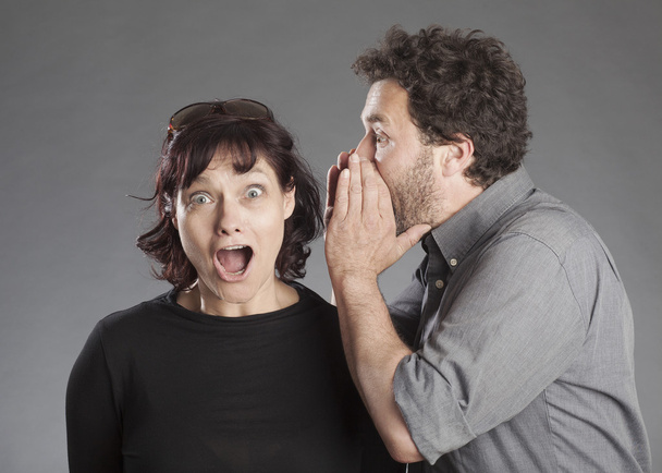 Mature couple man whispering secret in woman's ear - Foto, Imagem