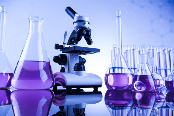 microscope and glassware in laboratory - Photo, Image