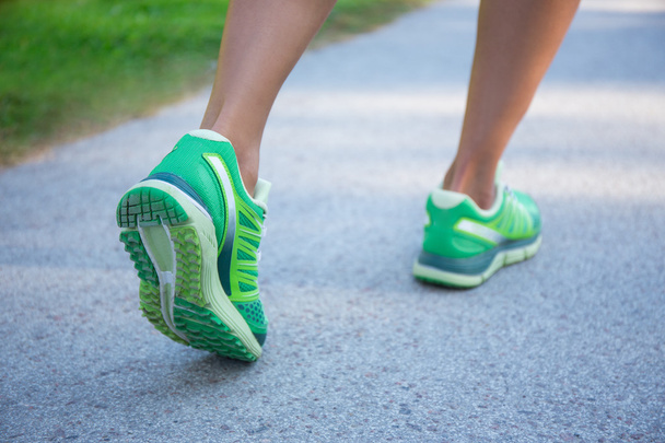 jogging woman in green running shoes - Photo, Image