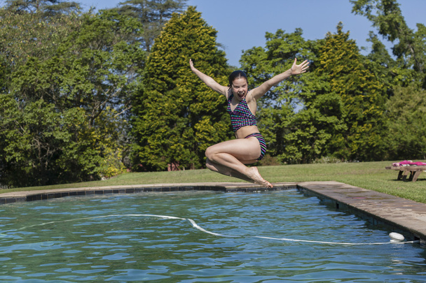 Girljumping Pool Fun - Photo, image