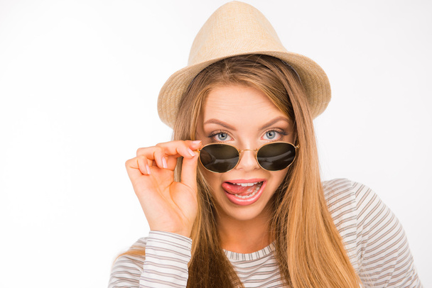 emotional funny girl with glasses and hat - Foto, afbeelding