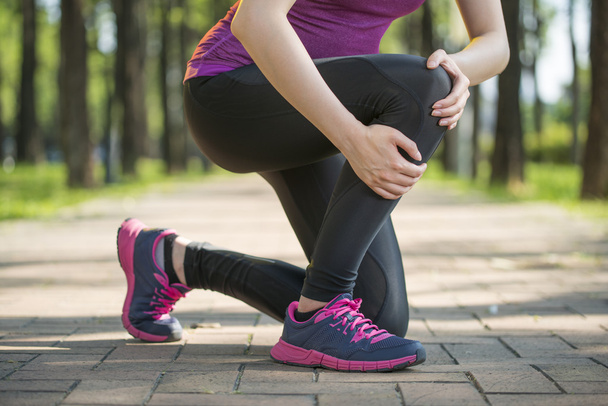 Asian woman runner hold Knee Pain ,Human Leg - 写真・画像