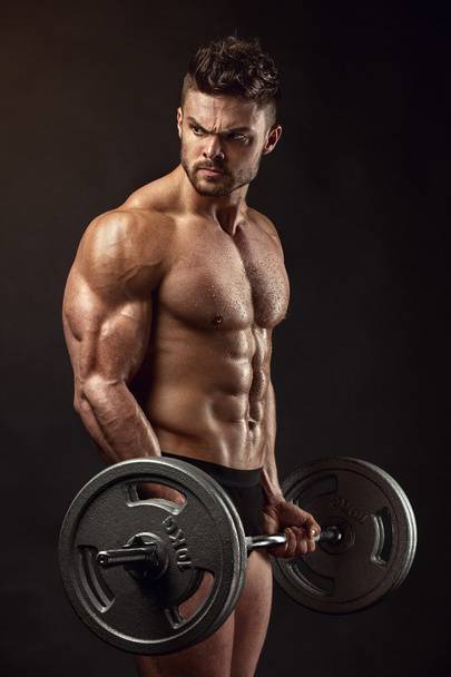 Musclé bodybuilder gars faire des exercices avec gros haltère
 - Photo, image