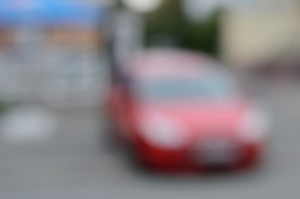background with strongly blurred red car - Photo, Image