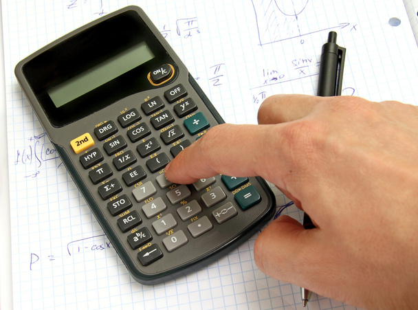 Науковий калькулятор на ноутбуці та руці
 - Фото, зображення