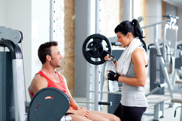 Man and woman friends on sport gym relaxed - Фото, изображение